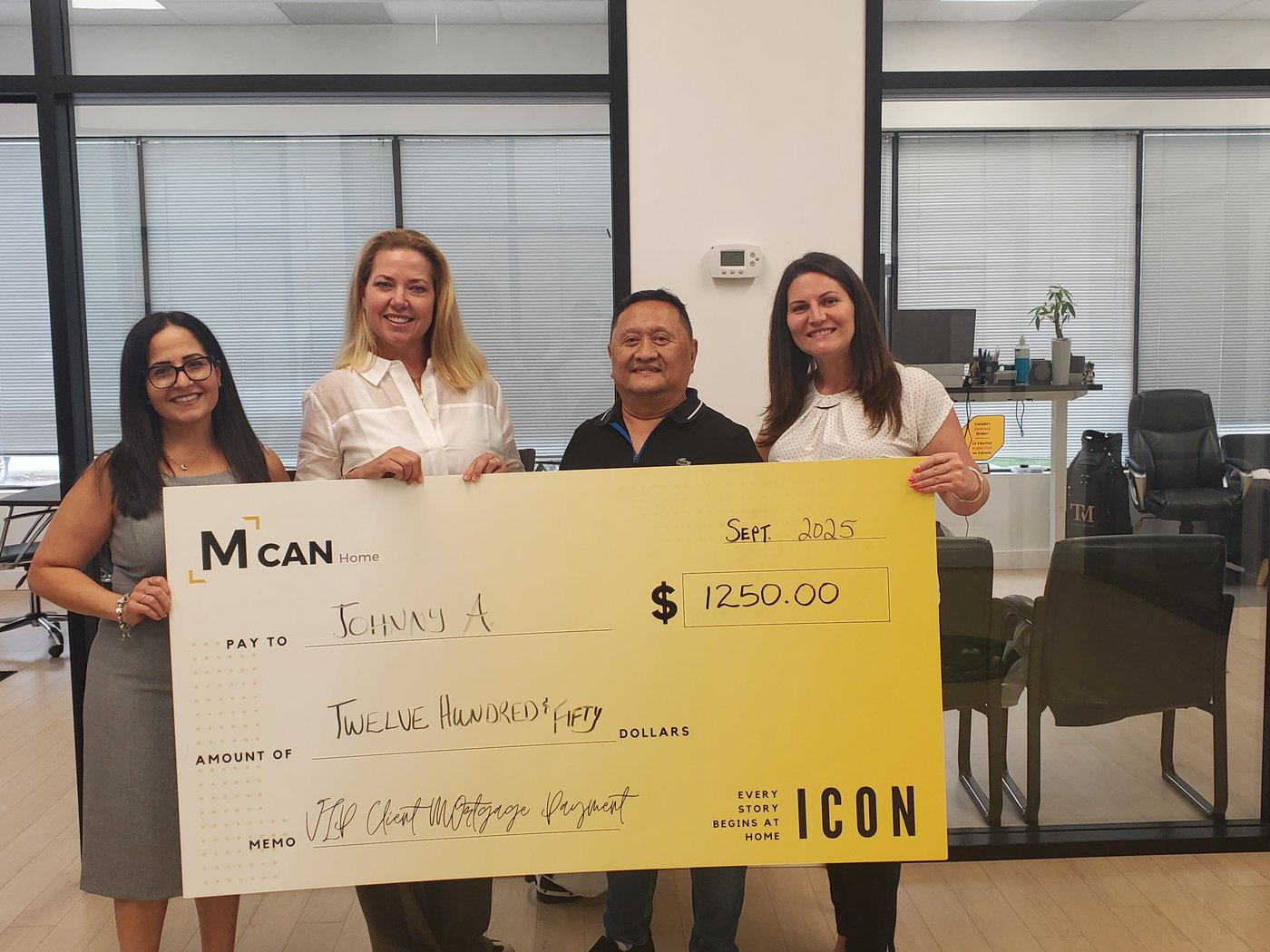 Leah at the MCAN Home Icon client cheque presentation